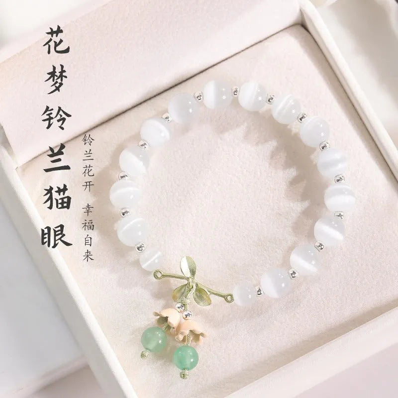 Close-up of electroplated opal cat's eye beaded bracelet for women with diamond-shaped charm