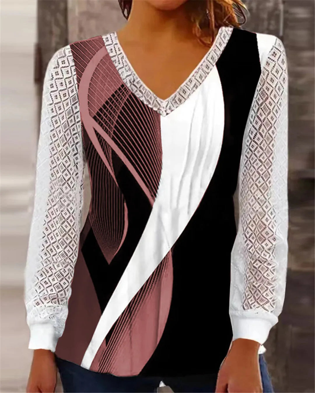 Women's loose purple V-neck lace top with long sleeves on a hanger.