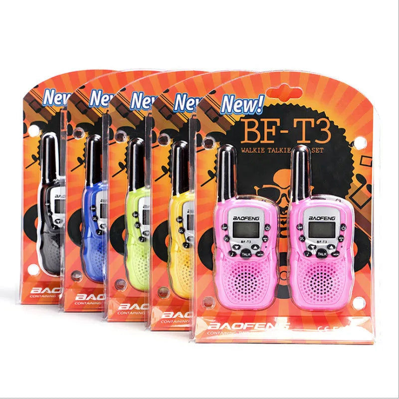 Child holding colourful walkie talkie with 22-channel display and push-to-talk button