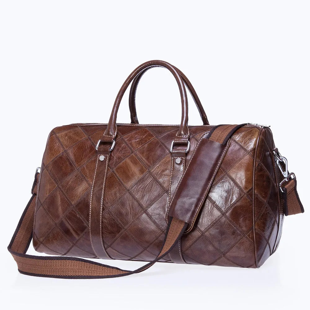Vintage checked men's leather duffel bag with a single shoulder strap, shown in a light coffee colour.
