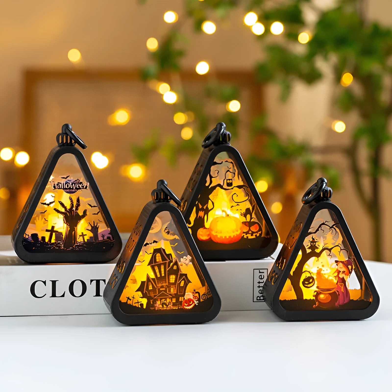 A plastic pumpkin-shaped Halloween lamp decoration with a flickering LED light, shown in one of four colour themes.