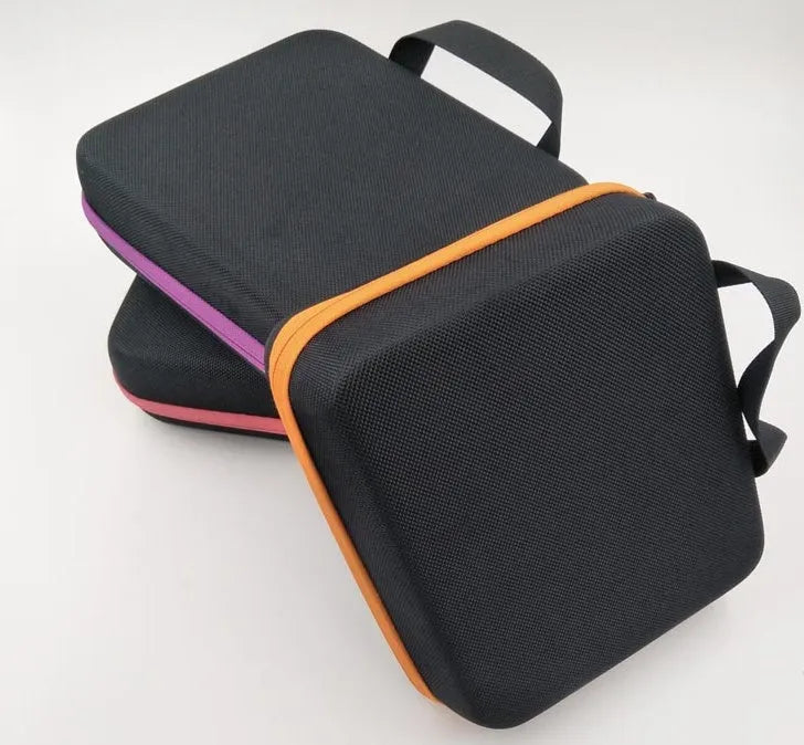 Red EVA essential oil storage bag with 30 compartments mounted on a wall