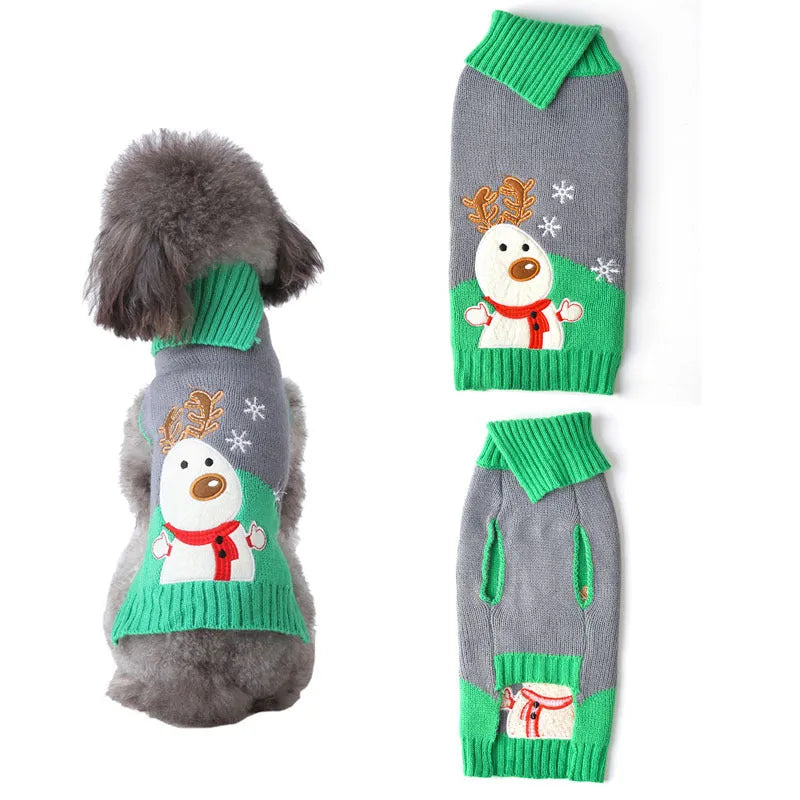 Small grey dog wearing a black Christmas sweater with white pompom and reindeer pattern