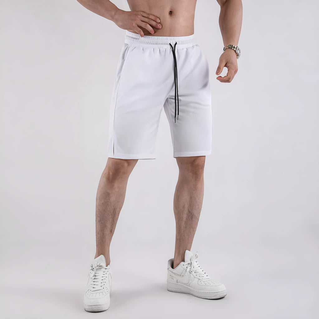 Man wearing black quick-drying mesh fitness shorts with elastic waistband