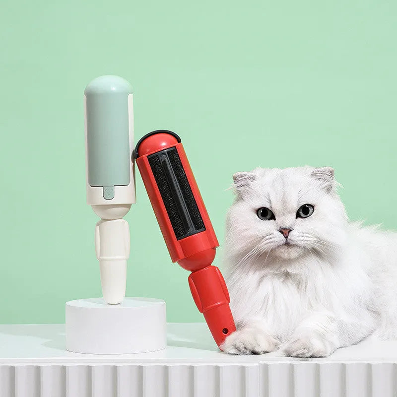 White green pet hair remover roller with self-cleaning base and non-slip handle on a carpet.
