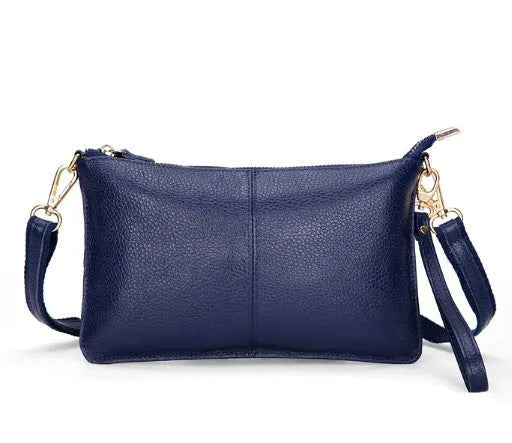 A cowhide lady slant bag in a chosen colour, showing hand and shoulder straps, with dimensions of 24 cm by 14 cm.