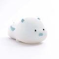 Blue or pink pig silicone night light with sleeping design, shown with dimensions and rechargeable battery.