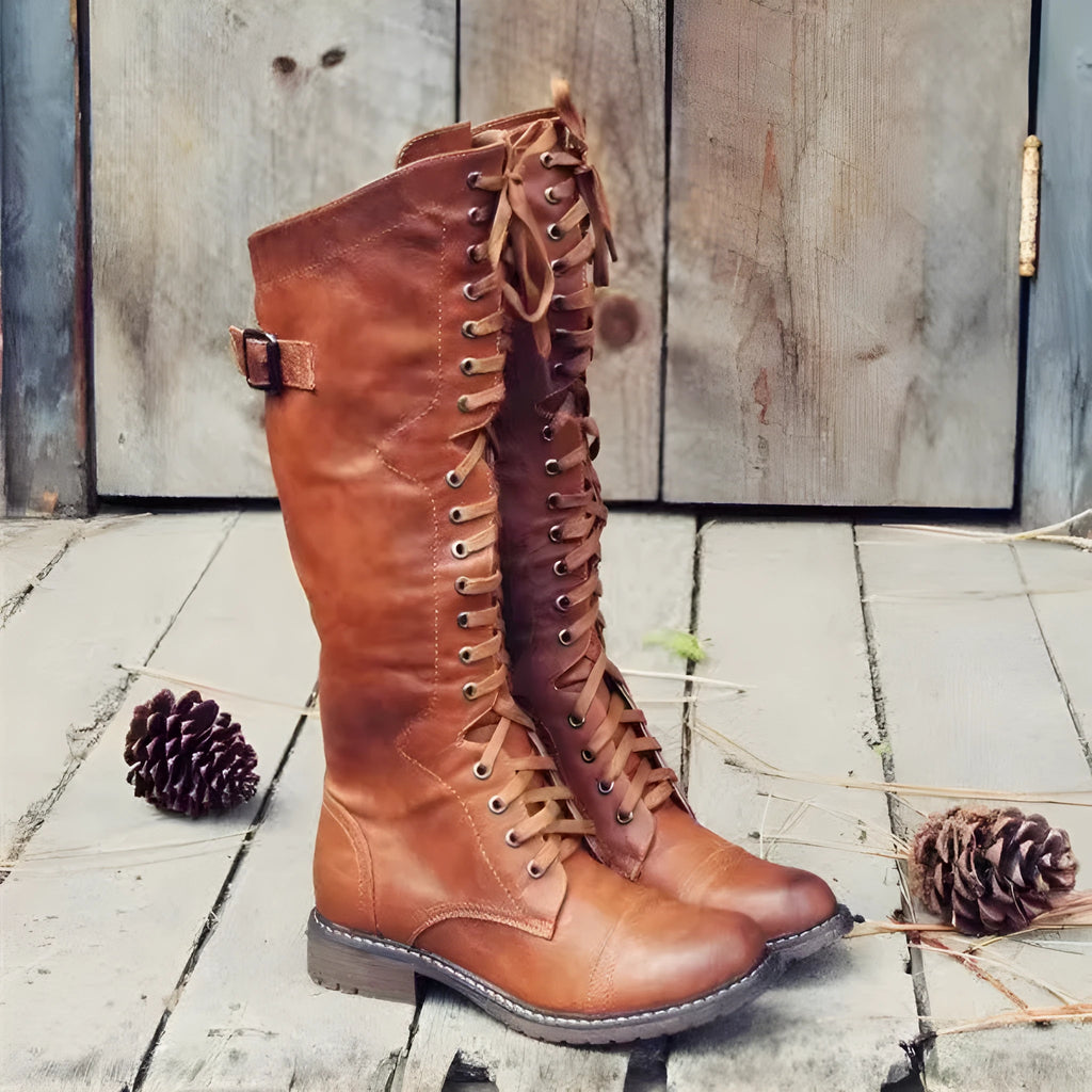 Women's black chunky heel high leg boots with a round toe and pull-on design.