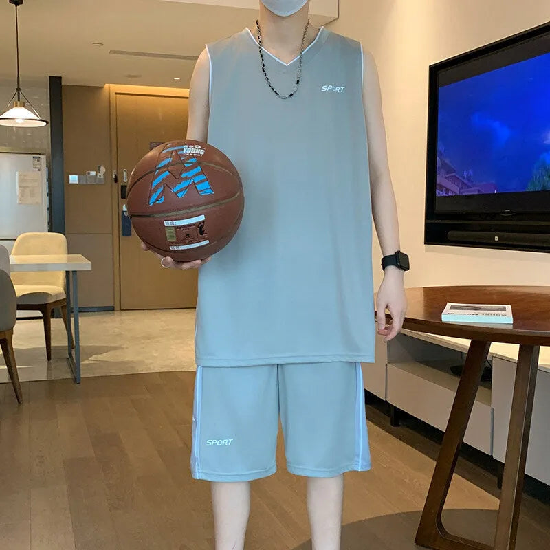 Light grey polyester basketball vest and shorts sports suit laid flat