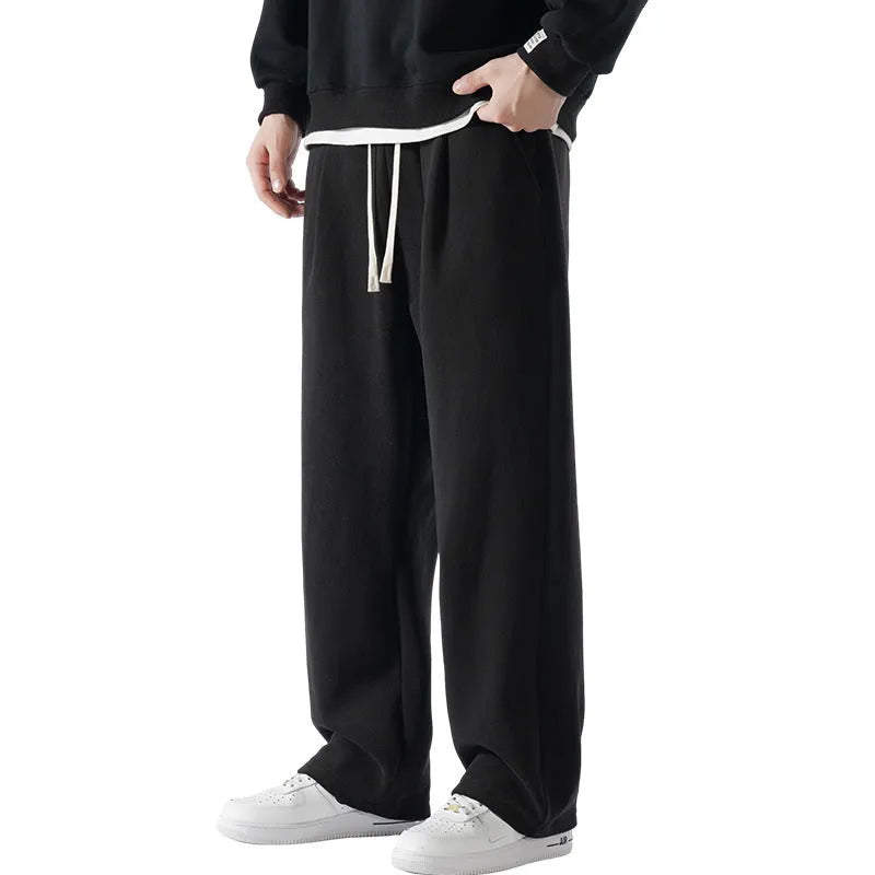 Men's apricot coloured loose-fit polar fleece winter sports pants with a drawstring waist.