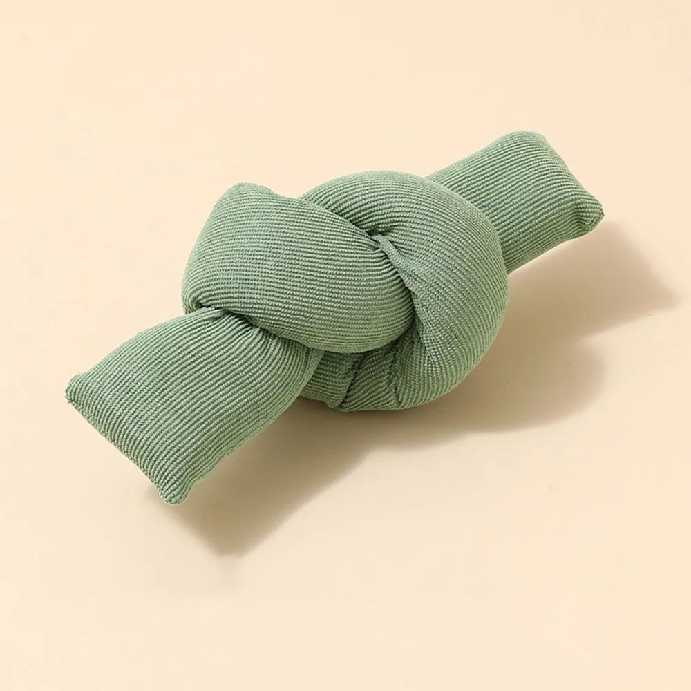 White knotted cotton dog rope toy for tug of war and dental flossing.