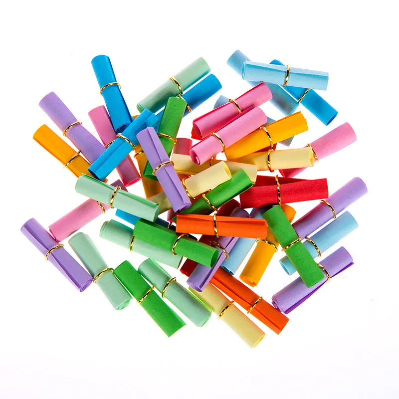 Colourful miniature paper scrolls for drift bottle messages with central eyelet for string attachment
