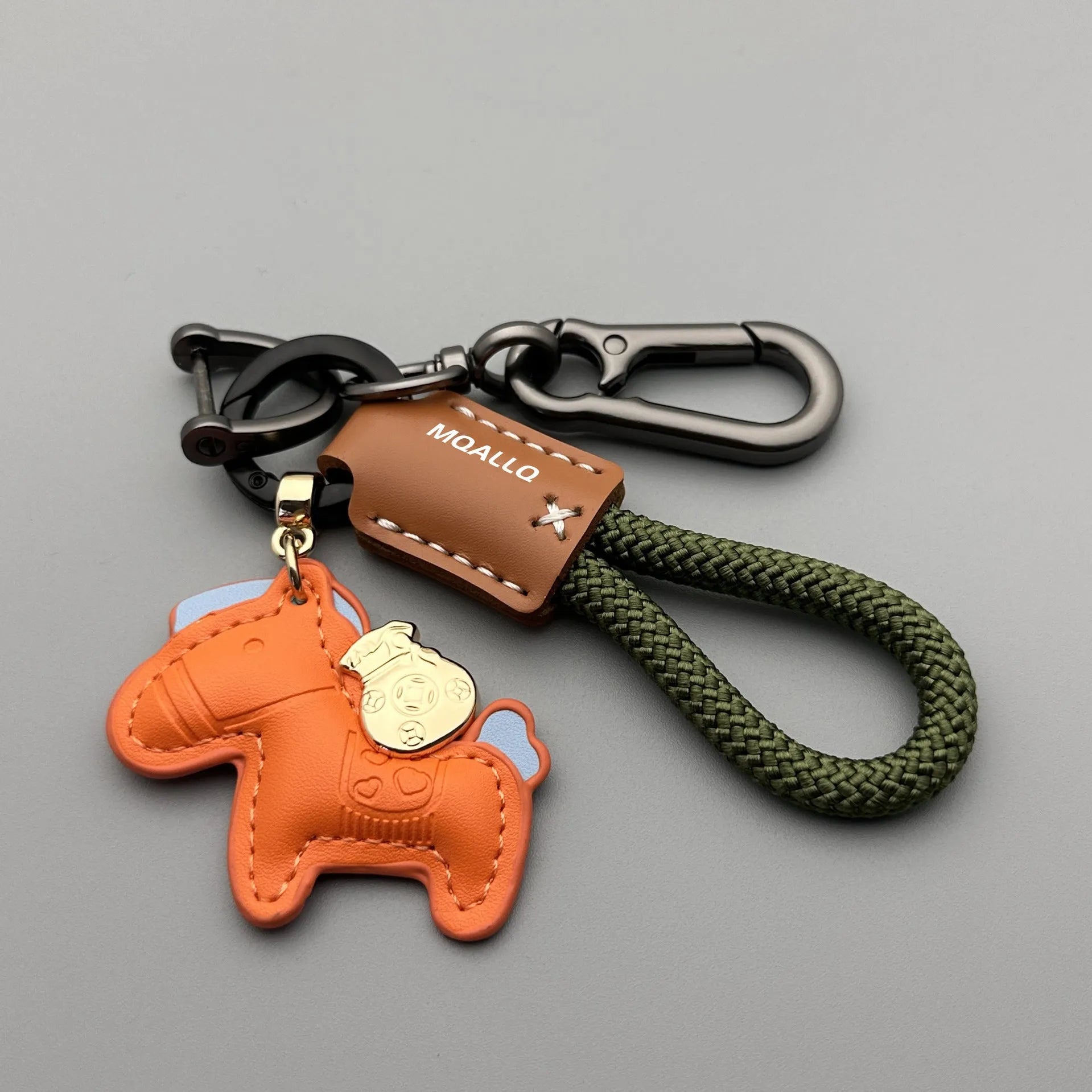 Handmade cowhide car key ring pendant with zinc alloy pony belt buckle on a colourful flanelle rope.