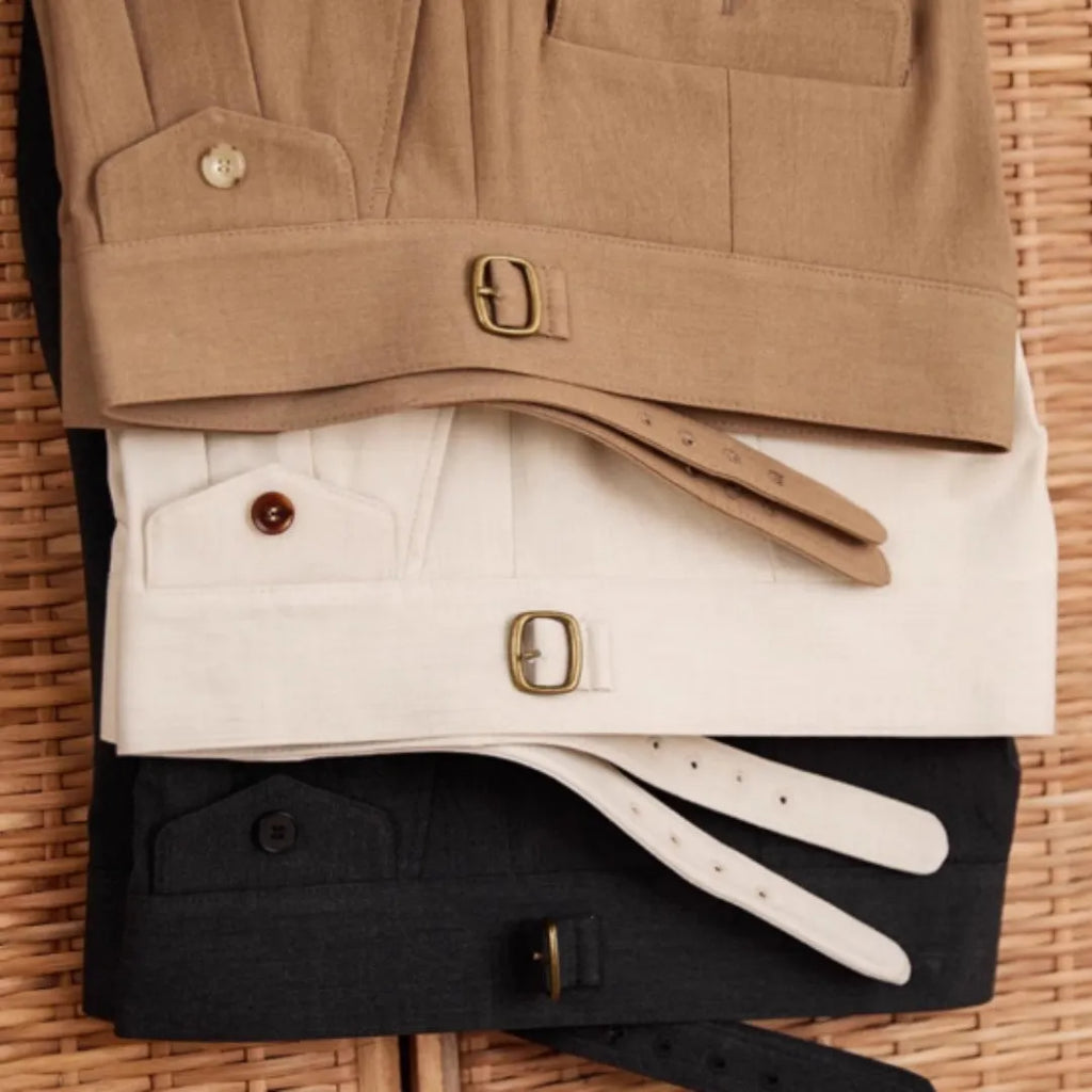 Men's slim fit straight leg trousers in light brown, laid flat.