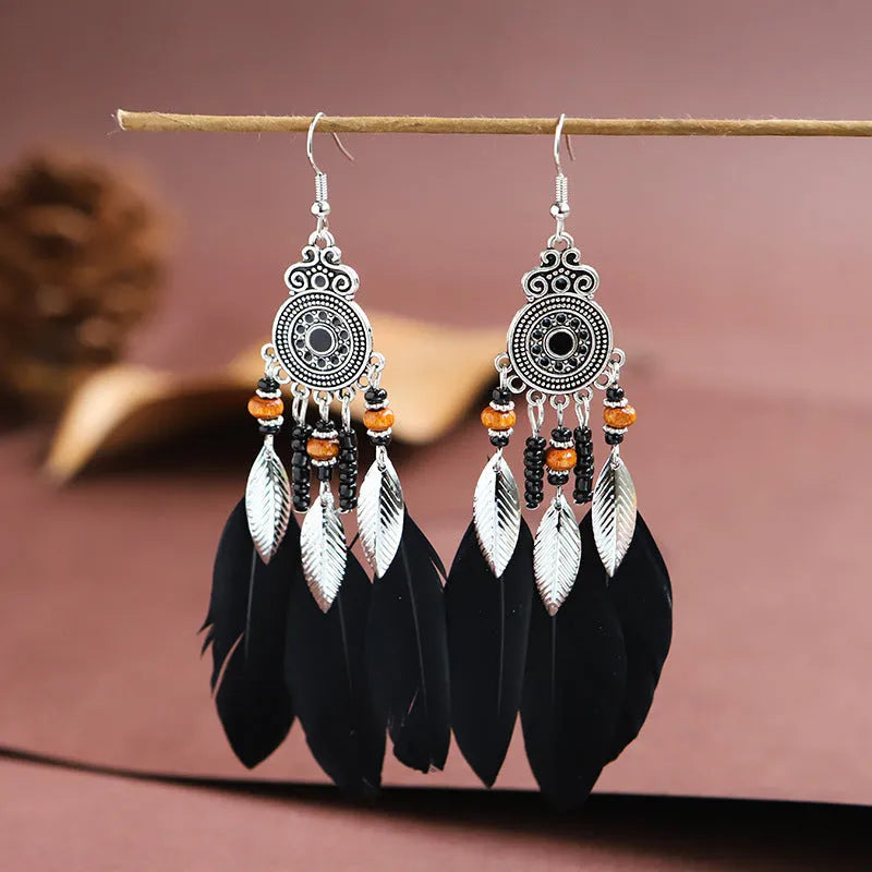 Bohemian style round drop feather earrings with leaf design in alloy, showing electroplated finish.