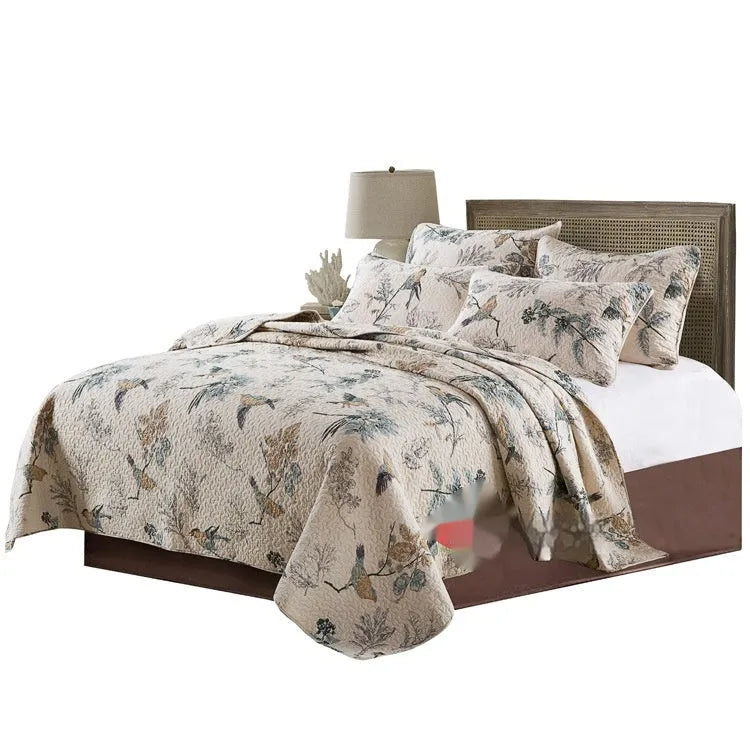 Quilted pure cotton bed cover and pillowcase set in a checked pattern on a double bed.