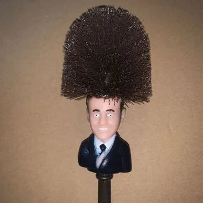 Yellow plastic Donald Trump novelty toilet brush with hanging slot, 40cm length