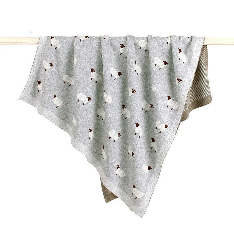 Pink and grey 100x80cm baby sheepskin blanket made from 100% cotton with a windproof cover.