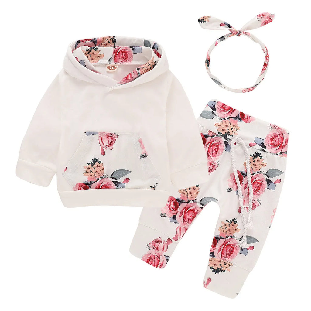 White cotton hooded tracksuit set for infant girl with long sleeves and trousers.