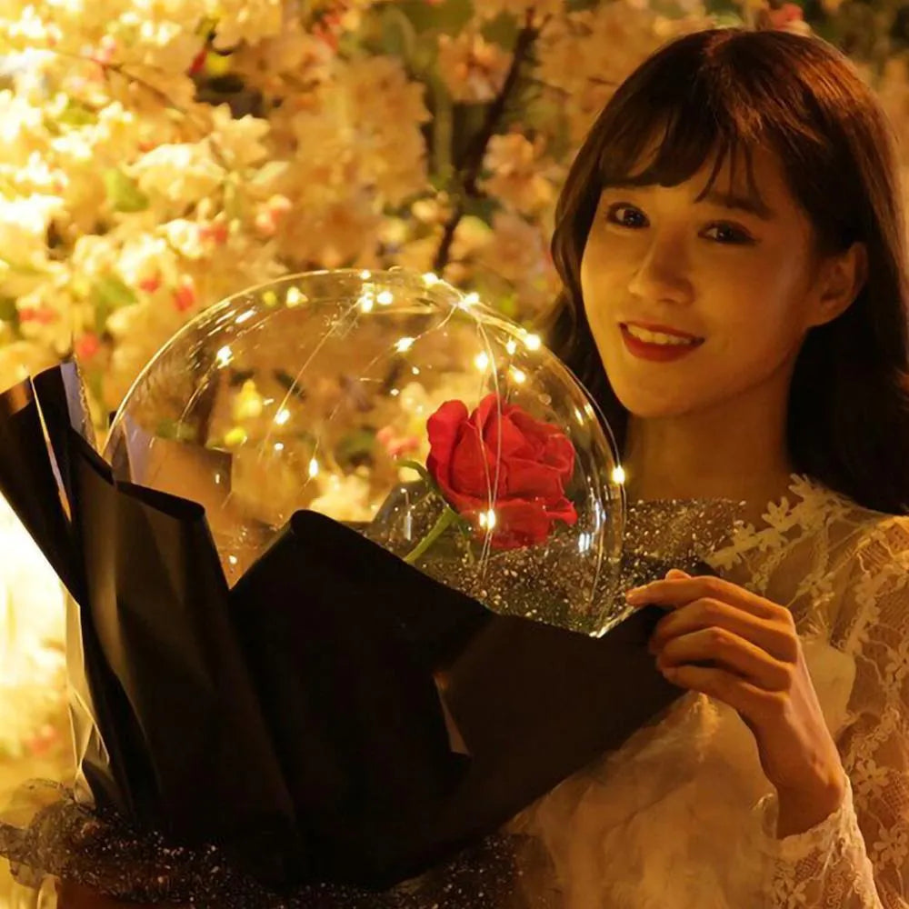 DIY LED luminous transparent balloon rose bouquet kit with artificial flowers and lights for assembly.