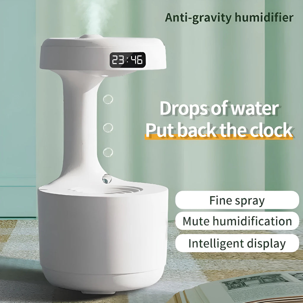 White columnar anti-gravity humidifier with LED clock display and mist output on a wooden desk.