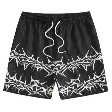 Man's thin polyester mesh beach shorts in a solid colour with a printed design, laid flat.