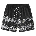 Man's thin polyester mesh beach shorts in a solid colour with a printed design, laid flat.