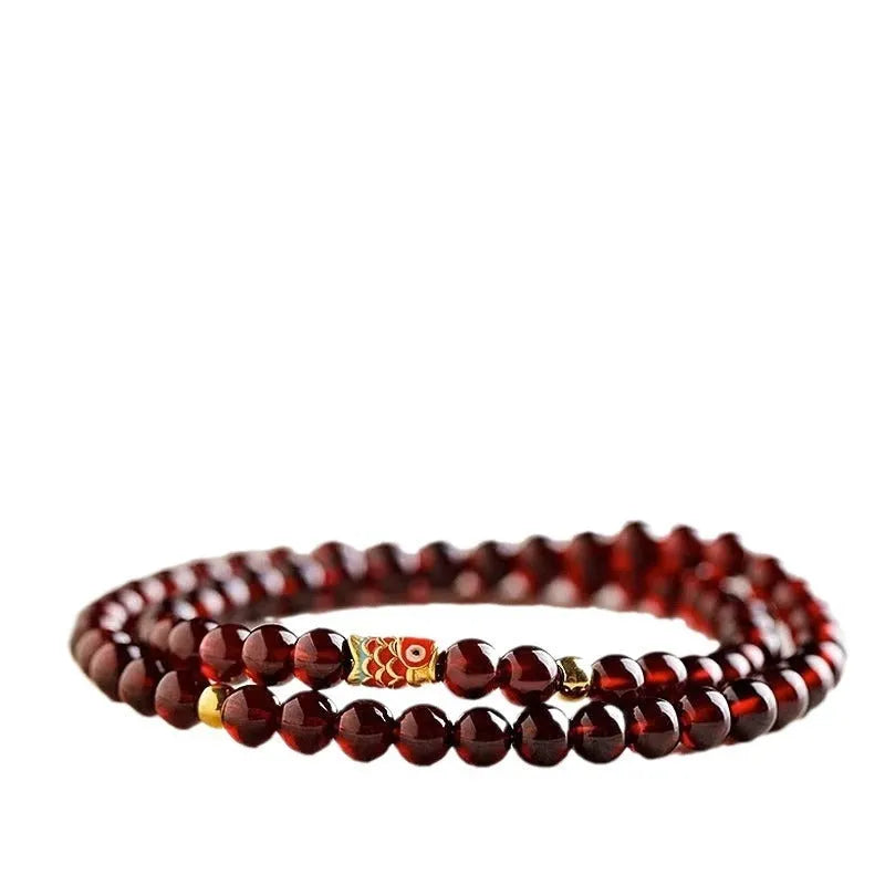 Wine red garnet coloured glass bead bracelet in New Chinese style, shown in single and double circle options.
