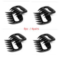Two black bear claw meat shredder forks for pulling pork and BBQ preparation.