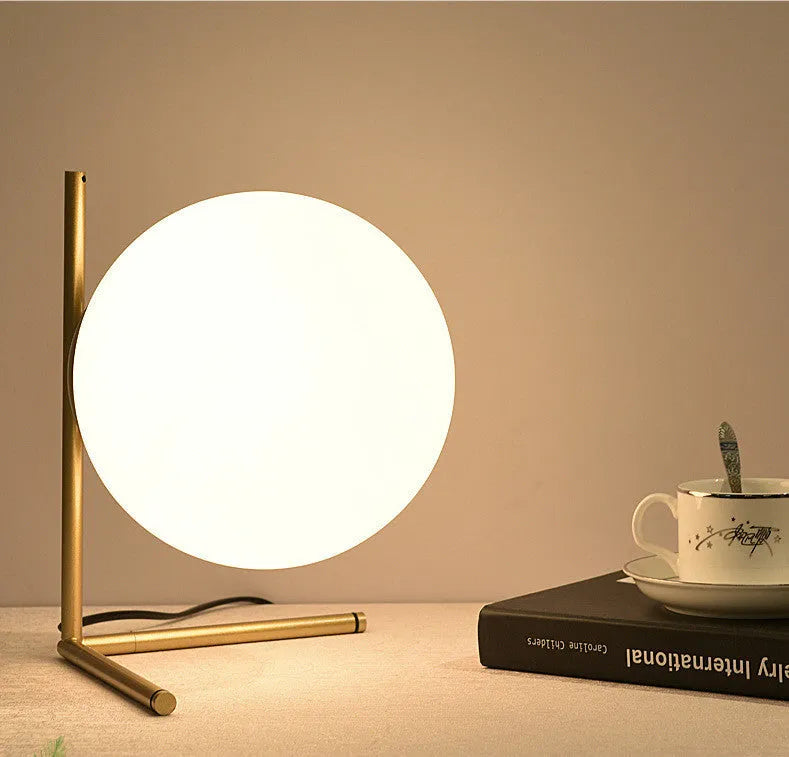 Creative LED lamp with glass shade in three size options showing three-tone lighting capability