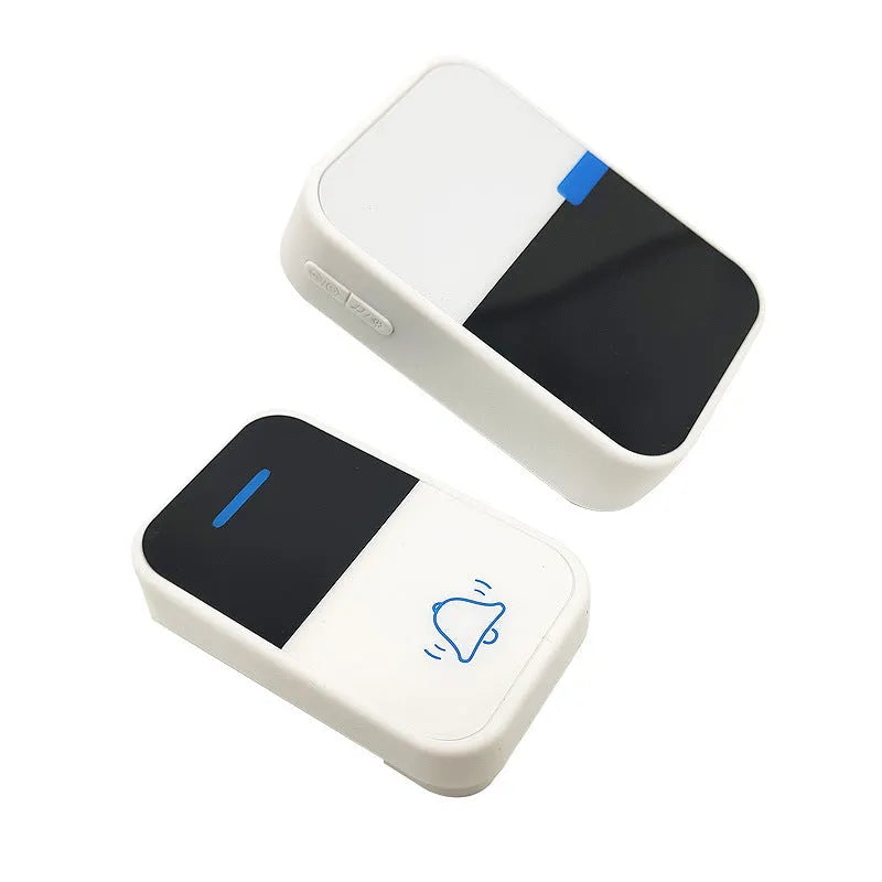 Modern white wireless doorbell kit with plug-in receiver and self-powered push button on a wooden door frame.