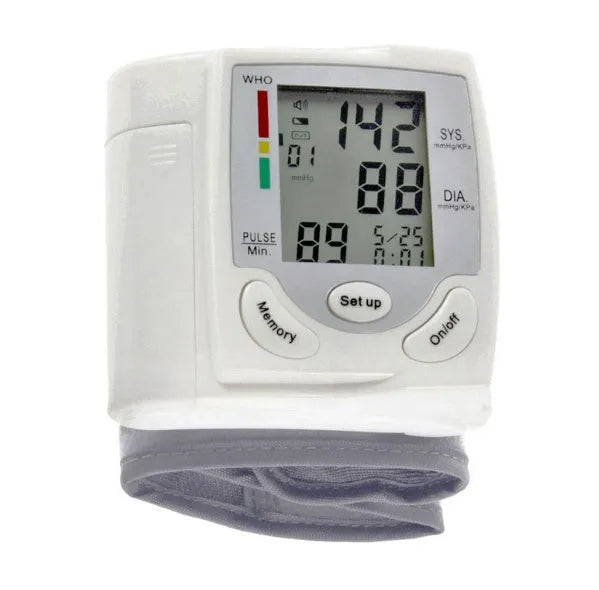 Grey portable wrist blood pressure monitor with digital display showing measurements
