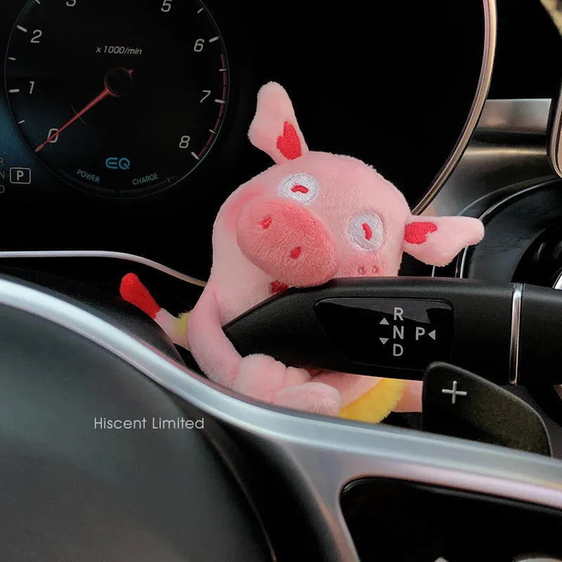 Cute cotton car decoration doll showing a pilot dog design on a dashboard.
