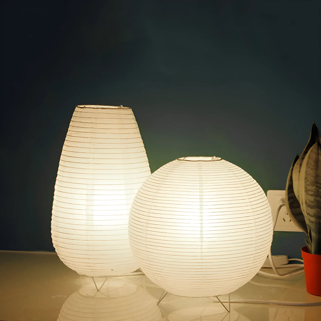 White rice paper table lamp with traditional handwork on bedside table