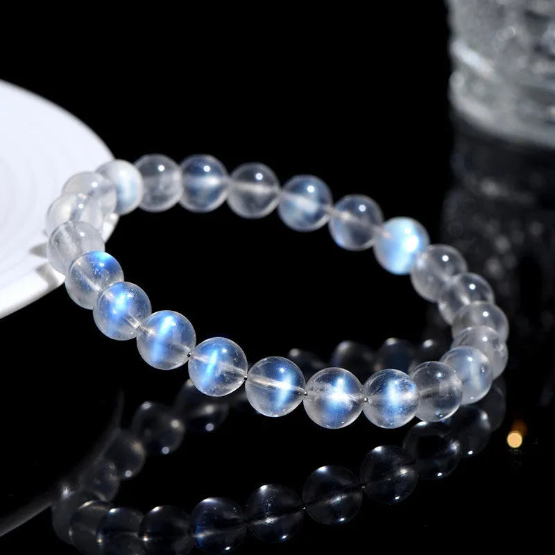Natural cream body blue moonlight crystal bracelet showing minimalist design on wrist.