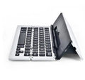 Foldable aluminium wireless Bluetooth keyboard in silver, compatible with Apple, Android, and Windows devices