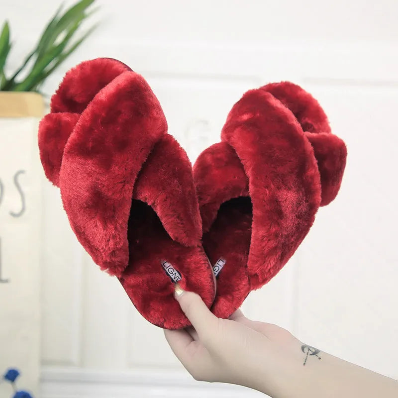 Women's cross open-toe fur slippers in assorted colours on a patterned non-slip sole.