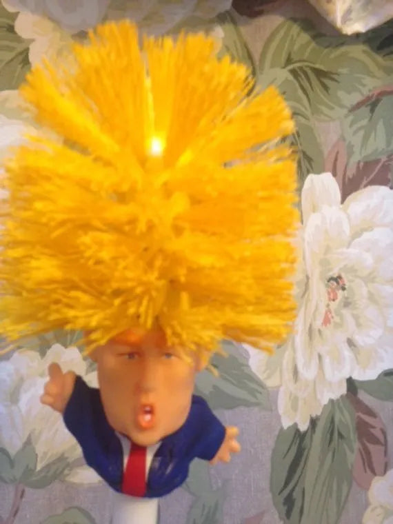 Yellow plastic Donald Trump novelty toilet brush with hanging slot, 40cm length