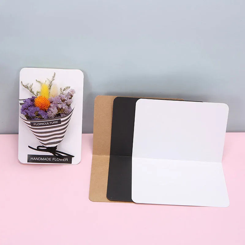 Pack of 100 blank A6 kraft paper folded cards in black, white, and natural brown colours