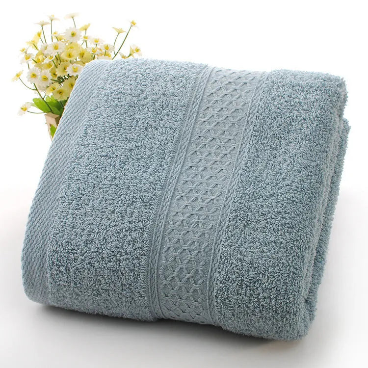 Thick bath and beach towels in seven colour options including apple green, dark blue, and light pink