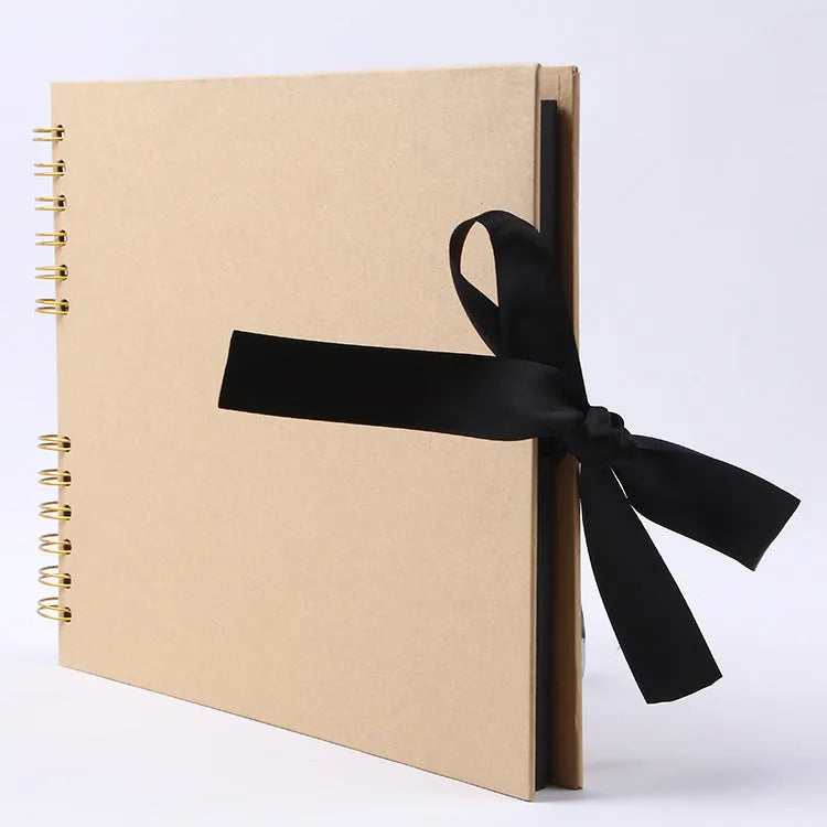 Yellow and black handmade DIY photo album with coil binding, sized 290mm by 215mm.