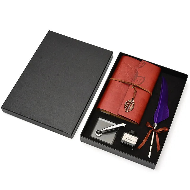 Feather dip pen gift set with copper pen, ink bottle, acrylic base, and antique book in box