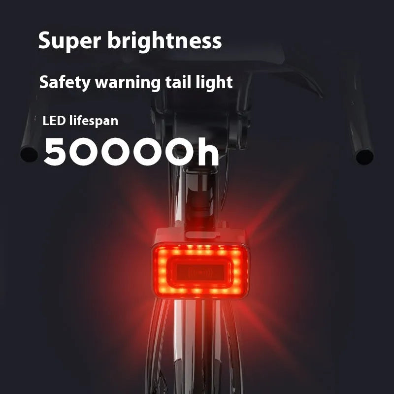 Compact black radar bicycle tail light with dual buttons mounted on a bike seat post