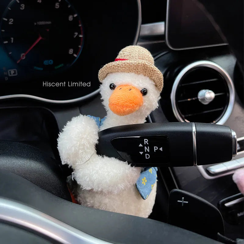 Cute cotton car decoration doll showing a pilot dog design on a dashboard.