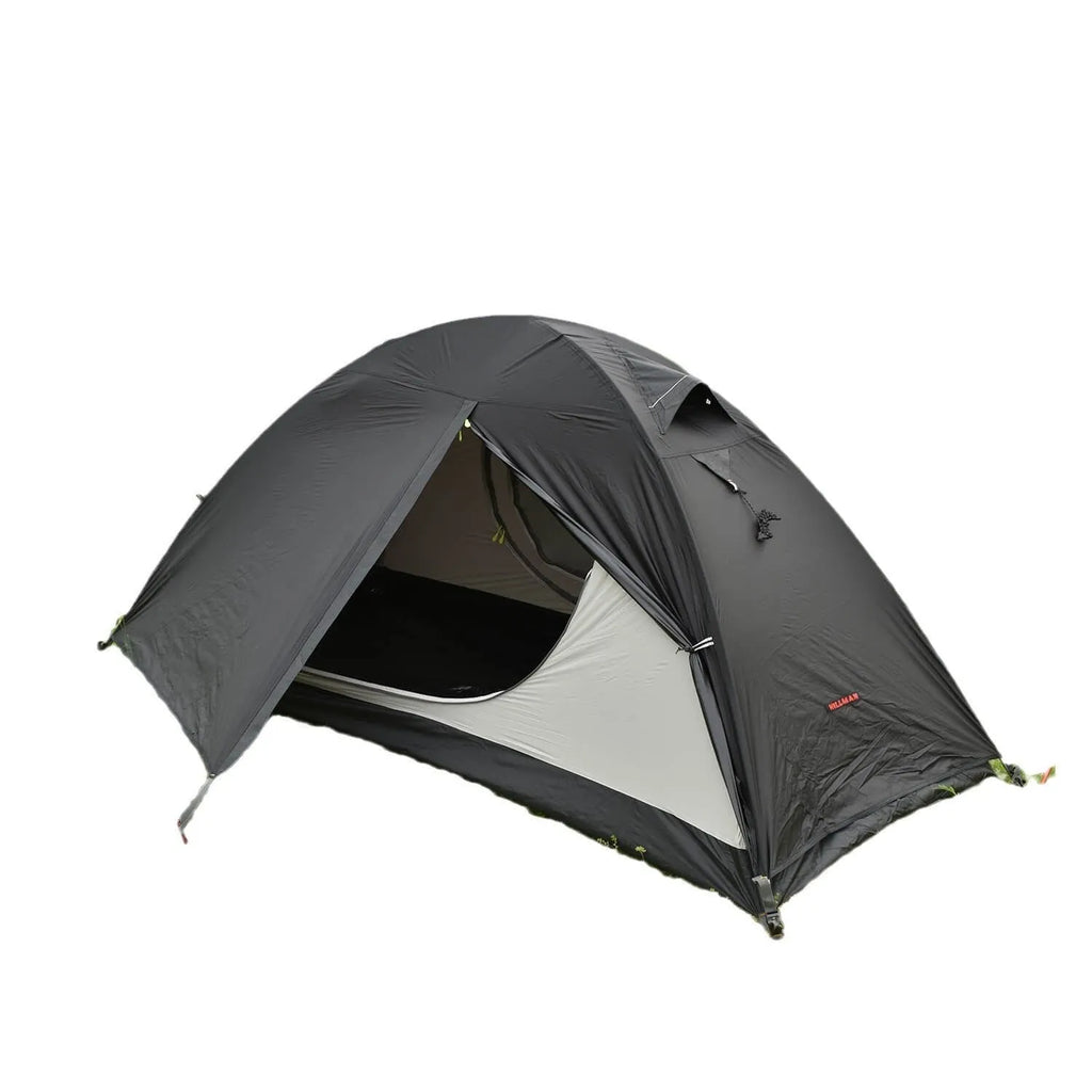 Single-person double-skin hiking tent in orange with aluminium poles, shown pitched in a field.
