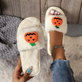 Open toe pumpkin plush slippers in synthetic fur with cartoon design and PVC soles