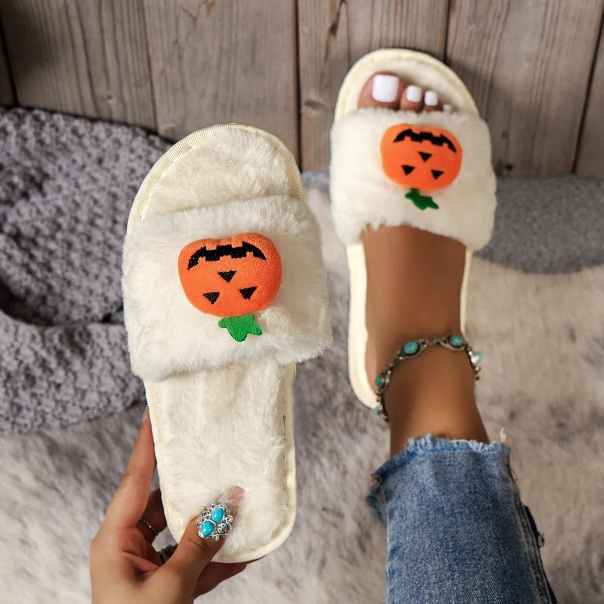 Open toe pumpkin plush slippers in synthetic fur with cartoon design and PVC soles
