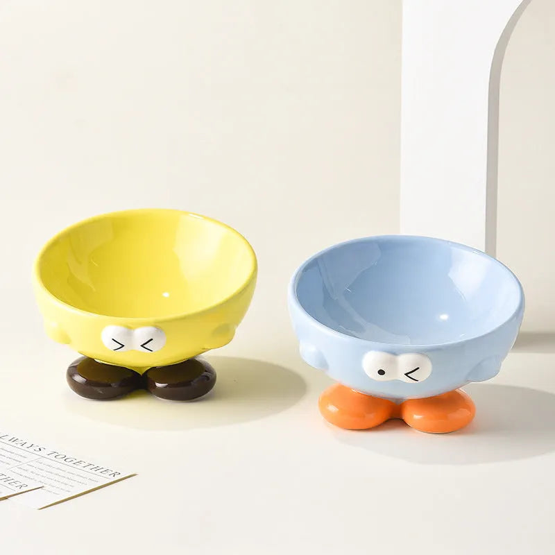 Ceramic pet bowl with oblique design and cute expressions for cervical spine protection