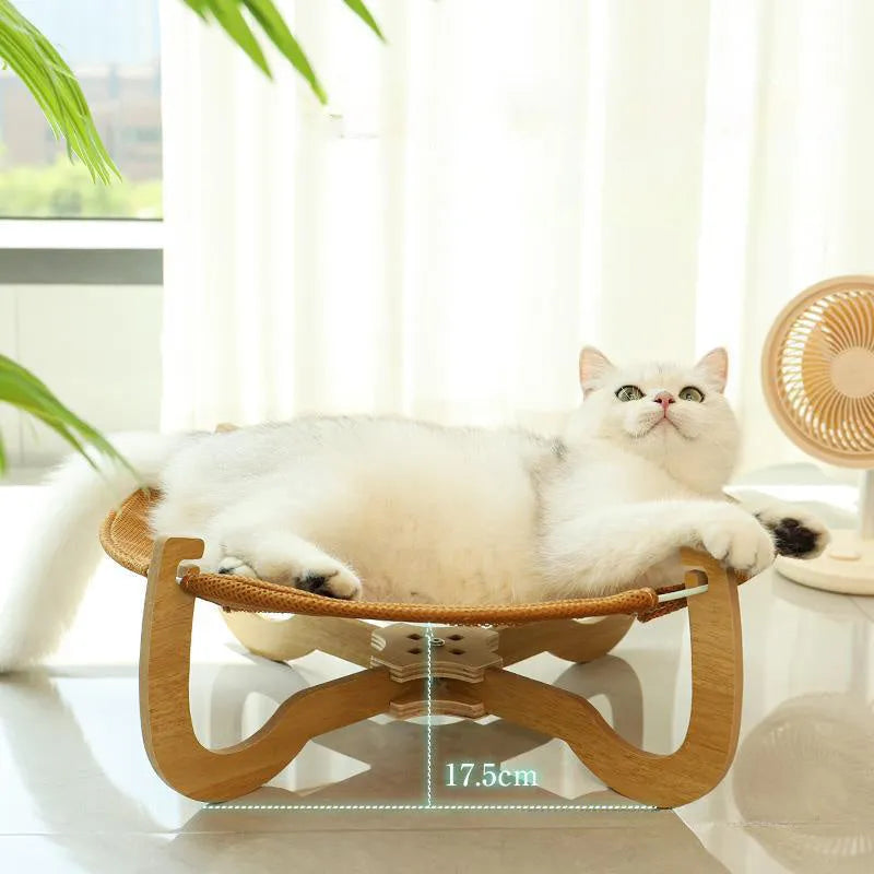 Brown woven rattan square pet hammock bed elevated off the ground.