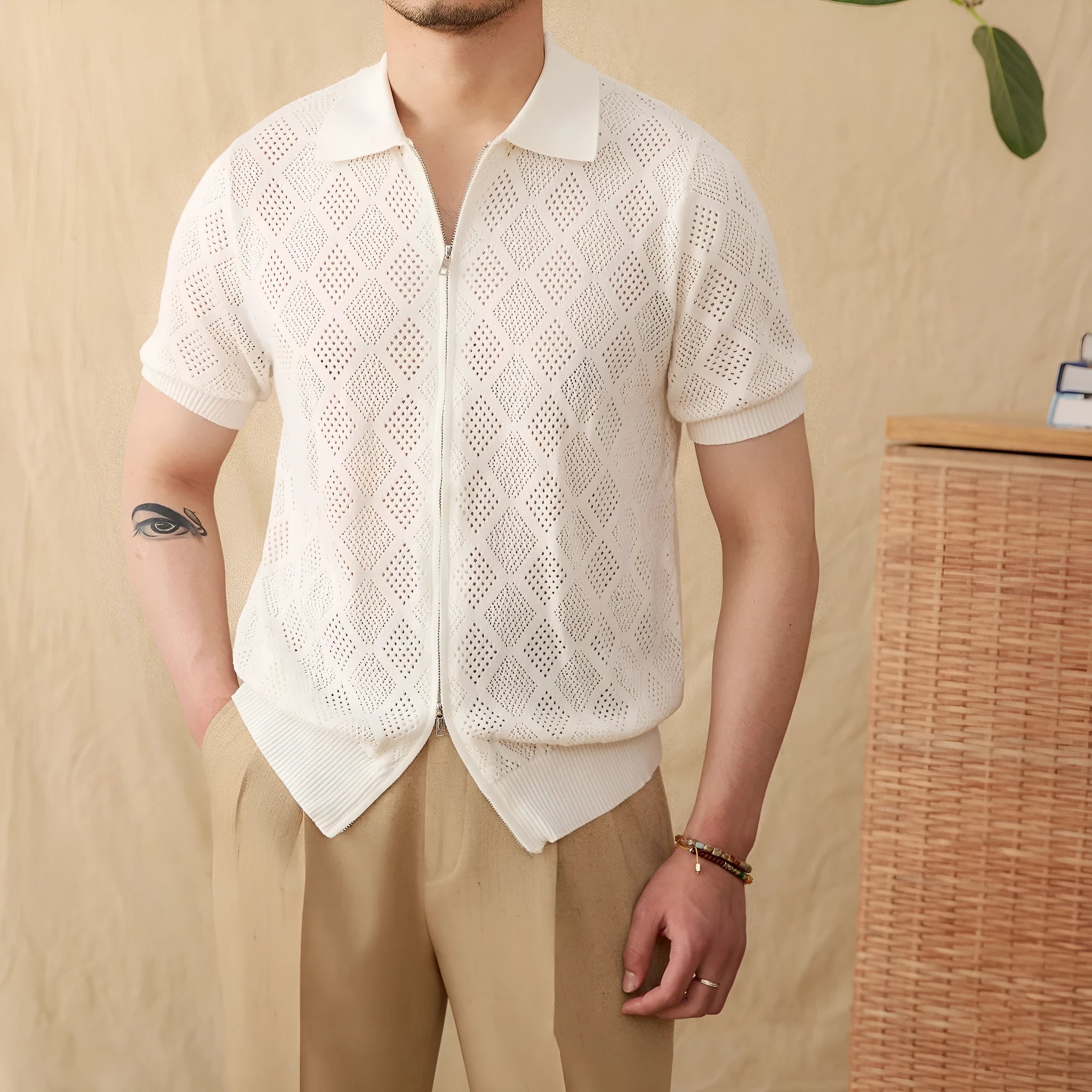 Women's light brown zip-front cotton cardigan with short sleeves and a lapel collar laid flat.